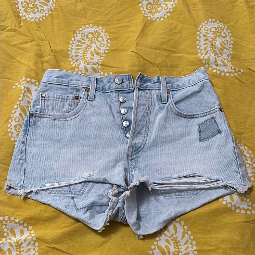 Levi’s 501 Light Blue Distressed Denim Shorts